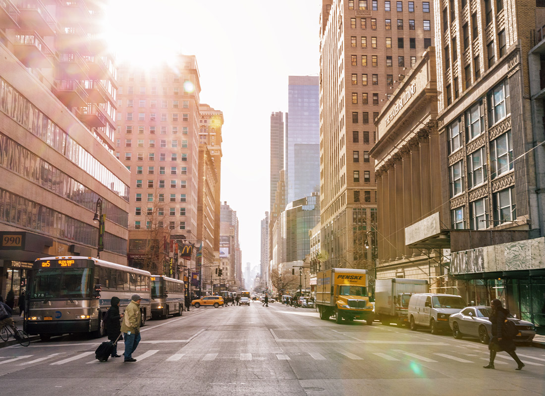 About Our Agency - Taxi Cars in a Busy Tourist Intersection of a Famous Street in New York, NY